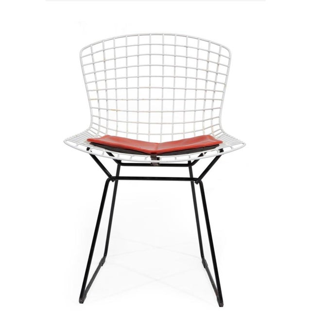 An enduring icon of mid-century modern design, this vintage wire chair reflects the sculptural brilliance of Harry Bertoia...