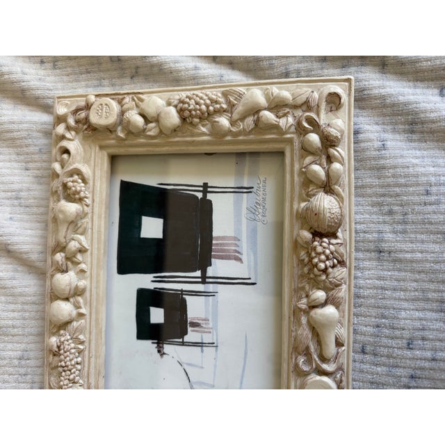 Small scale watercolor of an Amish carriage scene framed in a vintage resin fruit frame. Art is signed and dated 1988....