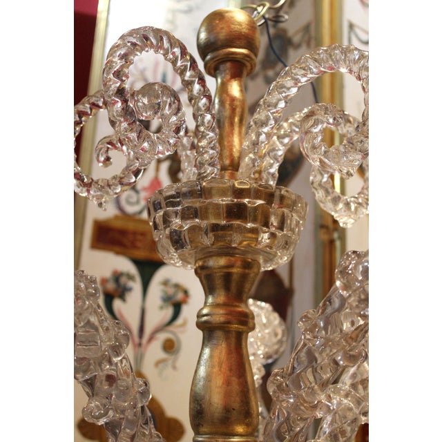 Make your home shine with this splendid and shimmering 1940s transparent mouth-blown Murano glass and giltwood flush mount...