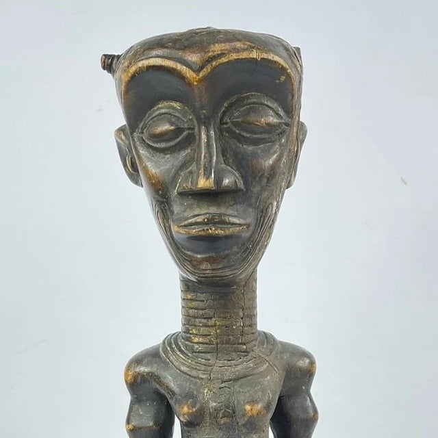 This powerful sculptural figure originates from the Ndengese people of the Democratic Republic of the Congo. The standing...