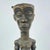 This powerful sculptural figure originates from the Ndengese people of the Democratic Republic of the Congo. The standing...