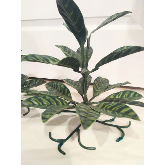 A wonderful fun rare pair of tole ware metal leaf decorative room decor. They're a fabulous fun pair and if desired they...