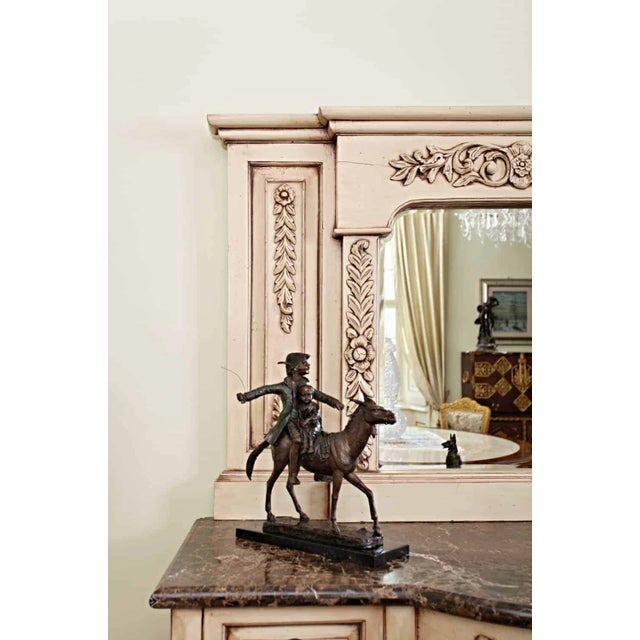 Luxurious neo-baroque chest of drawers from the 1920s with a heavy marble top. The chest of drawers is decorated with...