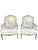 Charming pair of bergère accent chairs featuring a soft floral upholstery in delicate pastel tones. Crafted in a...
