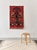 This tapestry was made from wool in Mexico in the 1970s. The high-quality, handmade knotted rug has a color scheme of red,...