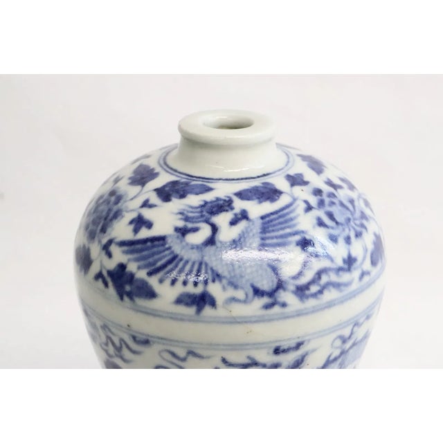 Beautiful antique meiping blue and white vase. 8.75 inches tall. Indistincly stamped to underside. There is a blemish on...