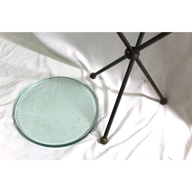 A very unique design of a small side table in hi-polished metal with Antique Brass finish. Each leg has a ball at top to...