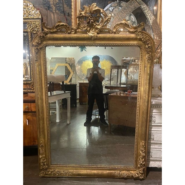 This 19th c. Louis Philippe carved and giltwood mirror exudes elegance and charm, making it a beautiful addition to any...