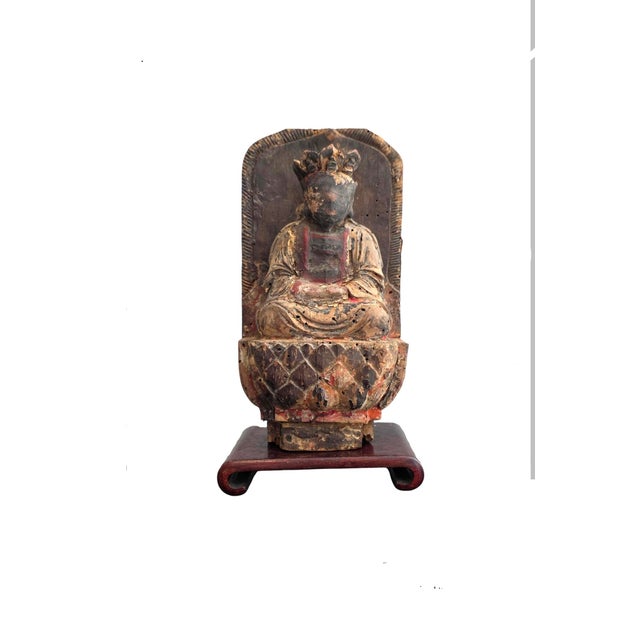 This richly carved and gilded Bodhisattva sculpture is almost certainly a fragment of a larger structure, most likely an...