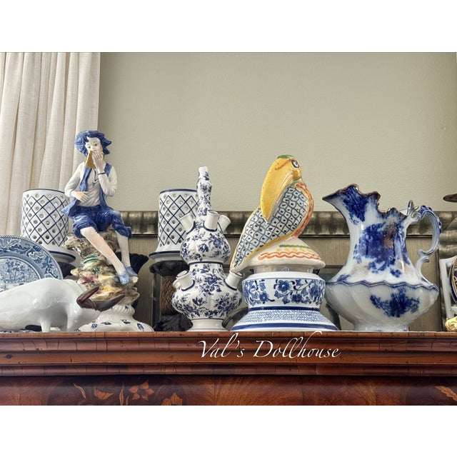 Always in fashion and relevant to most interiors, here is a unique two-piece blue and white vintage tulipiere in the delft...