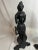 These antique French cast iron andirons, designed circa twentieth century are accompanied by female figures that obtain a...