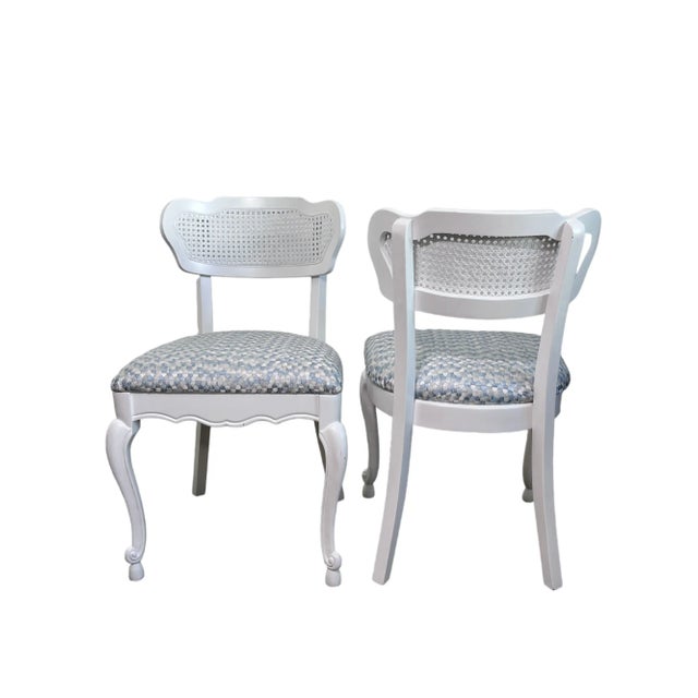 Like new. These four caned back chairs have been freshly re-lacquered in Benjamin Moore Super White. The cushions have...