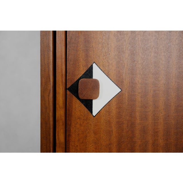 This cabinet was crafted in Denmark during the 1950s, is a timeless piece of furniture, combining the warmth of natural...