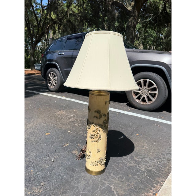 A striking table lamp crafted from an authentic antique wallpaper printing roller, showcasing the beautiful craftsmanship...