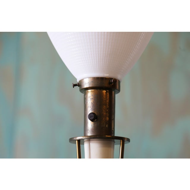 A vintage table lamp consisting of white enameled metal and brass. Unmarked but most likely made by Excelsior with parts...