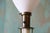 A vintage table lamp consisting of white enameled metal and brass. Unmarked but most likely made by Excelsior with parts...