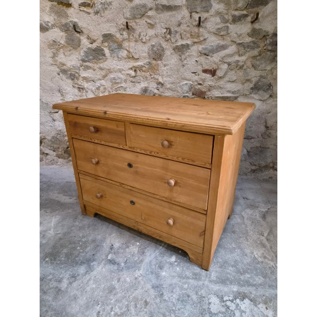Rustic pine chest of drawers dating from circa 1880–1920 and originating from Germany. Made of solid pine, the chest has...