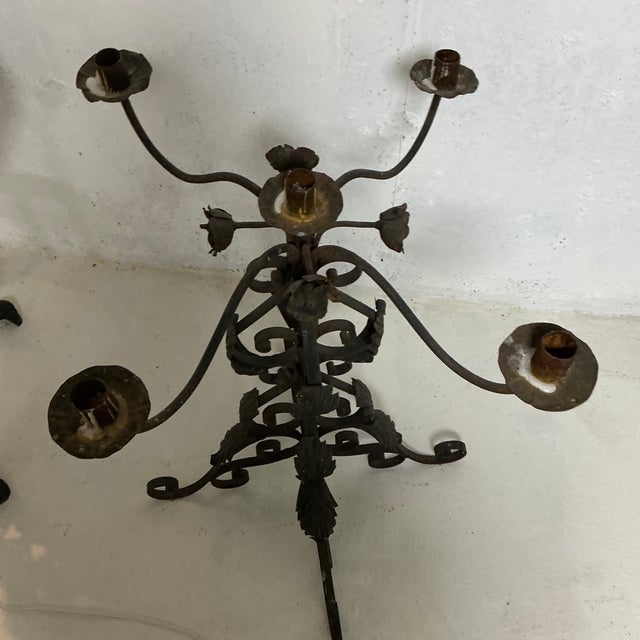 Antique wrought iron rusted candelabra. Holds 4 candles.