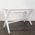 This Crate and Barrel desk features a sleek white finish and sturdy X-leg design, perfect for any home office or study...