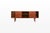 An elegant danish vintage sideboard in teak by h.p. Hansen, featuring a gently bowed front and beautifully balanced...