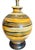 A large 1960's Mid-Century Modern pottery table lamp with fat lava glaze in tones of brown, green, gold, and cream. The...