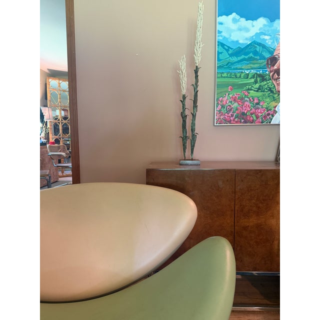 Circa 1950-1960 and signed by the artist with tag at base. Verdis patina to metal, and enamel dipped ‘flowers’ Tall,...