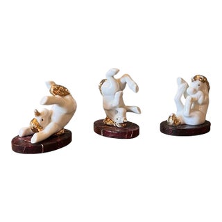 Set of 3 Vintage Tumbling Porcelain & Gilded Unicorn Figurines on the Faux Marble Stands For Sale