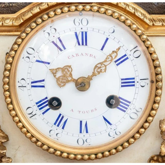 Louis XVI Style Gilt and Patinated Bronze and White Marble Clock, late 19th century, the white enamel circular dial with...