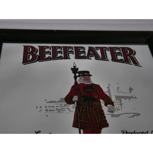 Vintage Beefeater Gin Advertising Mirror, 1960s, in Very Good conditions. Designed 1920 to 1949 This piece has an...