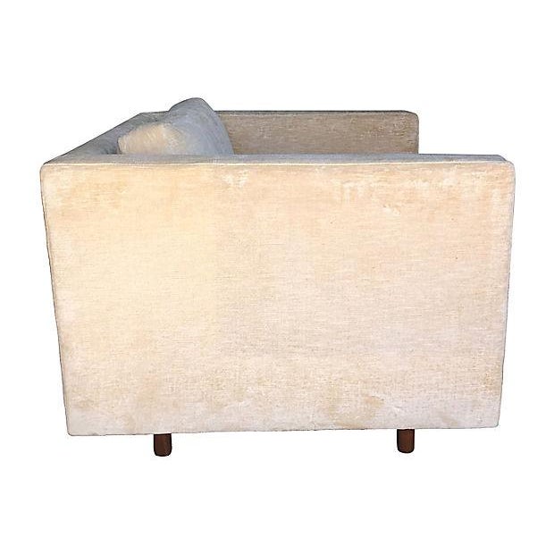 Tuxedo-style Harvey Probber lounge chair supported by signature round walnut legs with a floating effect. Upholstered in a...