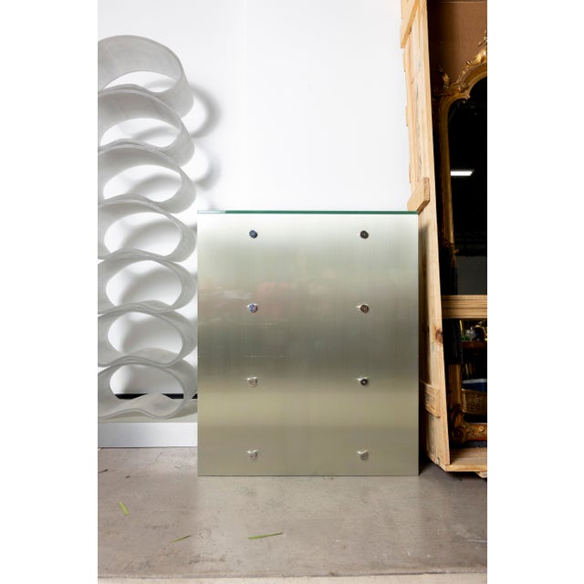 Custom entry/side table with clean lines and a thoughtfully crafted design. Minor wear consistent with use; a versatile...