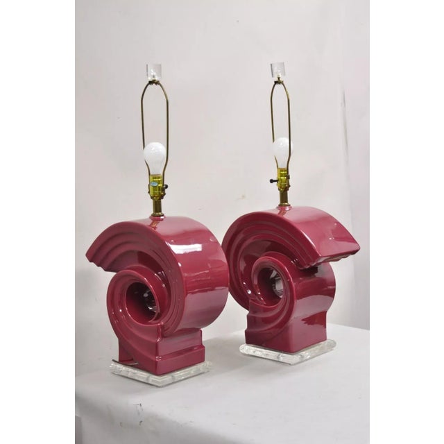 Vintage Postmodern Cranberry Red Sculptural Snail Scroll Ceramic Table Lamps on Lucite Bases - a Pair. Circa Late 20th...
