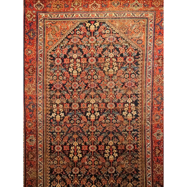 A 19th century Persian Malayer rug, dating from the fourth quarter of the 1800s. Rendered in an expansive gallery format,...