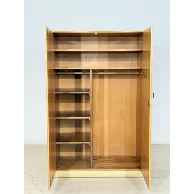 Very nice two-door wardrobe from the 1960s in good condition. Original German design from the 1960s, made of ash and beech...