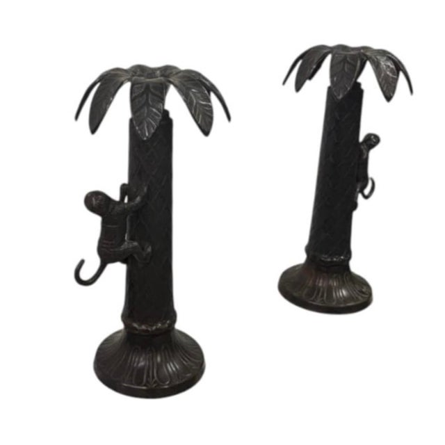 Bring a touch of whimsical sophistication and tropical charm to your space with this captivating pair of vintage cast...
