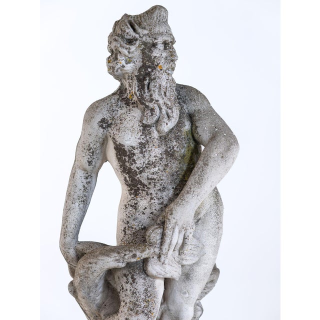 This Danish 1930s-1950s limestone figure of Neptune has a commanding presence defined by its weathered surface, softened...