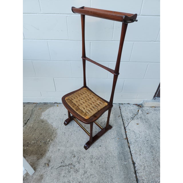 This is a Vintage mid-century modern Italian mahogany valet chair by SPQR, featuring a woven rush or rattan seat and...