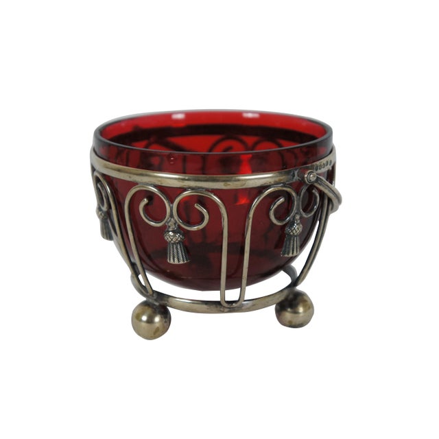 "Antique 19th century silver plate basket featuring simple scrolls of metal, accented with tassels, ball feet, rotating...