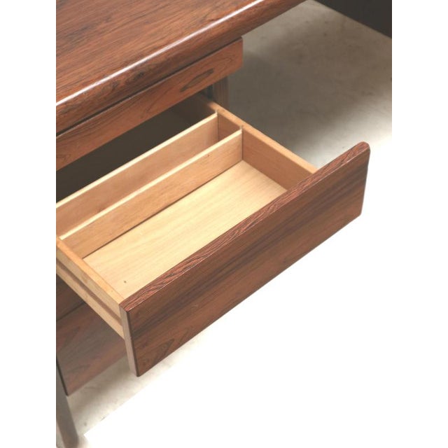 Large rosewood desk / executive desk from the 1960s. This large vintage boomerang desk from the 1960s is a striking and...