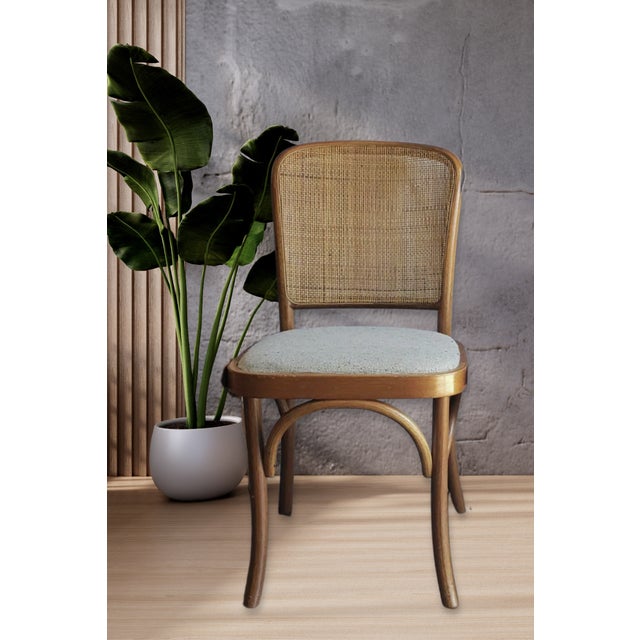 Elevate your dining space with this exceptional set of four (4) vintage "Prague" style dining side chairs. Masterfully...
