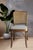 Elevate your dining space with this exceptional set of four (4) vintage "Prague" style dining side chairs. Masterfully...