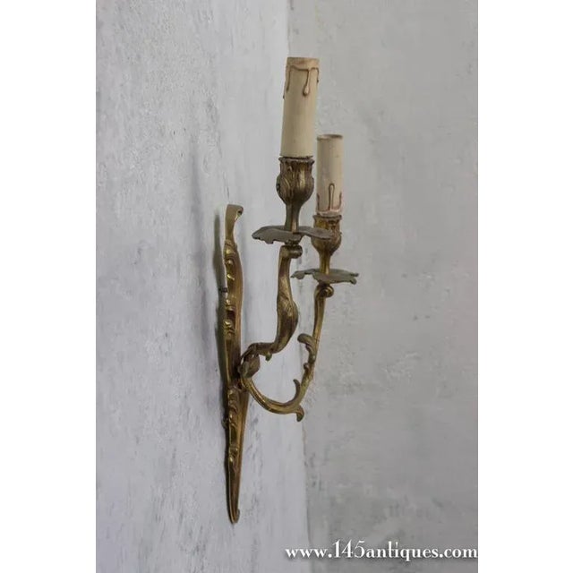 Mid-Century Modern Pair of French Louis XV Style Gilt Bronze Two-Arm Wall Sconces, 1920s For Sale - Image 3 of 10