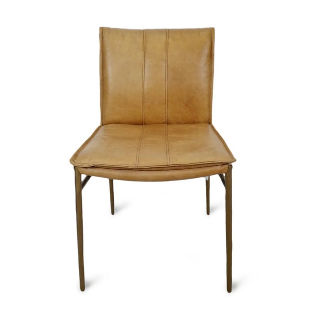 Palomino toned super soft leather dining chair with beautiful stitching detail. Matte bronze finish hand hammered iron...