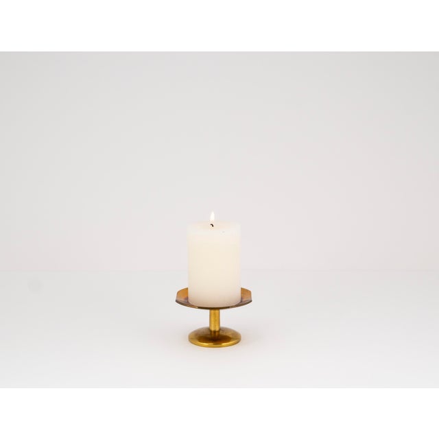 A prime example of the understated elegance of Mid-Century Modern design: this exquisite candle holder from the 1960s...