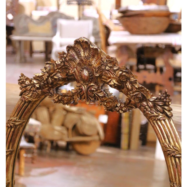 French Pair of French Louis XV Style Carved Patinated Giltwood Oval Wall Mirrors For Sale - Image 3 of 8