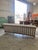 Vintage sofa by Manuel Martin, newly upholstered in a soft textured white fabric, featuring a spindle back beechwood frame...