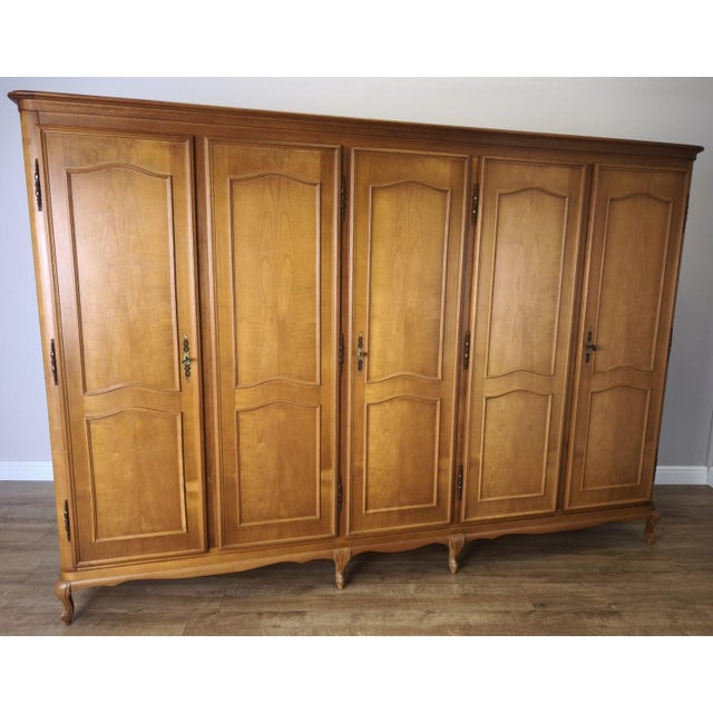 This impressive Vintage French Louis wardrobe offers grand proportions with elegant panelled doors and a beautifully...