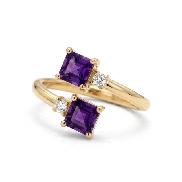 Elegant, modern, and deeply romantic. This beautiful "Toi et Moi" (You and Me) bypass ring features two vibrant 4x4mm...