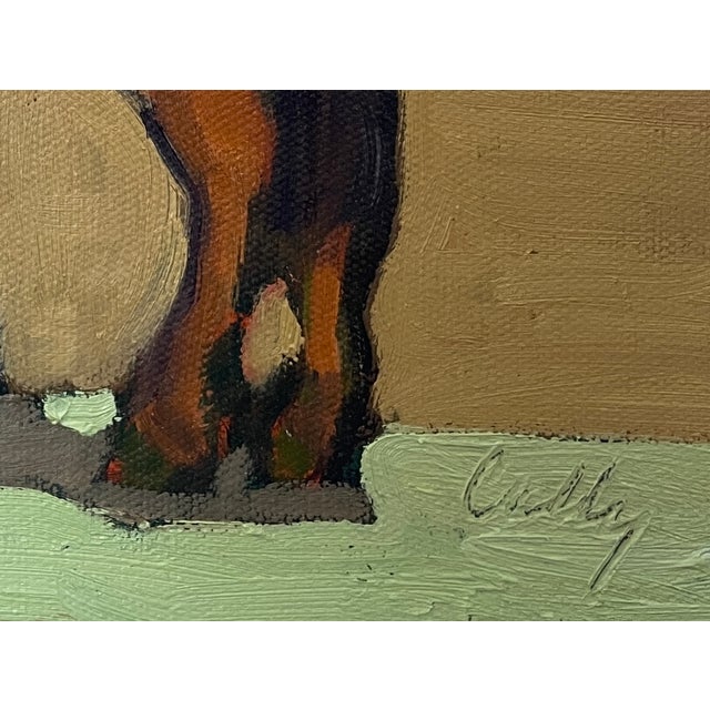 A small painting of a young colt and mother with a multiple of greens and beige background. A wrap around gallery frame is...
