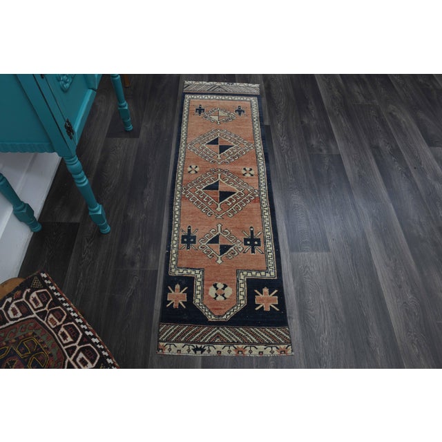 Vintage Hand-Knotted runner rug is a semi-antique vintage runner rug. The '70s Eastern region of Anatolia's unique rug is...